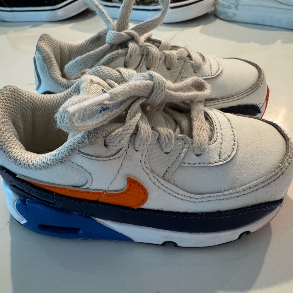 Nike Kids White and Navy Sneakers with Orange Swoosh